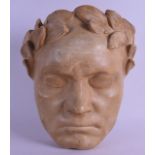 AN ANTIQUE PLASTER MASK in the form of a Roman Male wearing a laurel wreath. 22 cm x 25 cm.