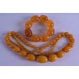 AN EARLY 20TH CENTURY AMBER BRACELET together with another amber type necklace. 57.3 grams & 55