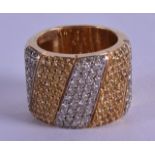 A STYLISH 18CT YELLOW GOLD AND DIAMOND RING. 22.3 grams.