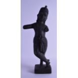 AN EARLY INDIAN CARVED STONE FIGURE OF KRISHNA modelled upon a square form base. 46 cm high.