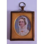 A MID 19TH CENTURY CONTINENTAL PAINTED IVORY PORTRAIT MINIATURE signed and dated 1868, modelled as a