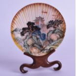 AN EARLY 20TH CENTURY CHINESE PAINTED SHELL upon a fitted stand, decorated with landscapes. 9.5 cm