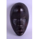 AN EARLY 20TH CENTURY AFRICAN CARVED TRIBAL WOOD MASK. 14 cm x 20 cm.