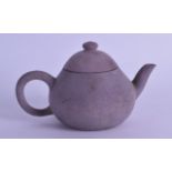 A CHINESE TEK SING CARGO YIXING TEAPOT AND COVER of flattened form. Signed. 15 cm diameter.