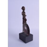 AN UNUSUAL EARLY 20TH CENTURY AFRICAN CARVED WOOD TRIBAL SPOON of figural form, upon a later