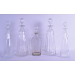 A GROUP OF FIVE VARIOUS DECANTERS. Largest 30 cm high. (5)