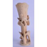 AN EARLY 20TH CENTURY AFRICAN CARVED IVORY BRUSH POT overlaid with a clambering monkey. 275 grams.