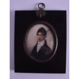 AN 18TH/19TH CENTURY PAINTED IVORY PORTRAIT MINIATURE depicting male wearing a white and black