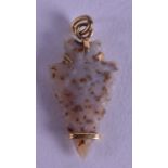 A 15CT YELLOW GOLD MOUNTED NEO LITHIC PENDANT.