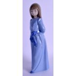 A NAO FIGURE OF FEMALE modelled wearing a blue gown. 25 cm high.