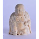 AN 18TH/19TH CENTURY CHINESE CARVED IVORY FIGURE OF A BUDDHA modelled seated. 5 cm high.