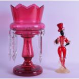 A VENETIAN RED AND WHITE GLASS FIGURE OF A BLACKAMOOR together with a cranberry glass lustre. 25