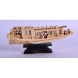 A MID 19TH CENTURY CHINESE CARVED CANTON IVORY BOAT decorated with figures in various pursuits, upon