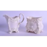 TWO ROYAL WORCESTER WHITE GLAZED PORCELAIN WARES of scrolling rococo form. 12 cm & 9 cm high. (2)