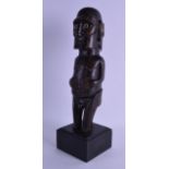 A GOOD EASTER ISLANDS CARVED HARDWOOD FERTILITY FIGURE with carved bone eyes, upon a later