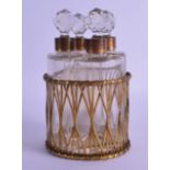 Late 19th c. set of four scent bottles with brass mounts in a basket weave brass basket. Good