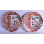 A LARGE PAIR OF 19TH CENTURY JAPANESE MEIJI PERIOD IMARI CHARGERS painted with panels of exotic