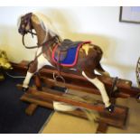 AN ANTIQUE ROCKING HORSE formed from pony hair. Fair condition