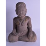 AN EARLY CAMBODIAN CARVED STONE FIGURE OF A BUDDHA with some gilt remnants. 34 cm x 22 cm. Fair