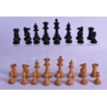 AN ANTIQUE STAUNTON PATTERN CARVED WOOD AND EBONISED CHESS SET within a wooden box. Largest piece
