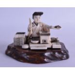 A GOOD 19TH CENTURY JAPANESE MEIJI PERIOD CARVED IVORY OKIMONO modelled as a cook holding a pan. 9.5