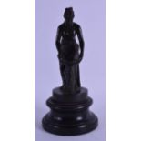 A 19TH CENTURY ITALIAN GRAND TOUR BRONZE FIGURE OF A CLASSICAL FEMALE upon a circular incised