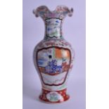 A 19TH CENTURY JAPANESE MEIJI PERIOD SCALLOPED VASE painted with figures within an interior. 32 cm