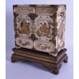 A FINE 19TH CENTURY JAPANESE MEIJI PERIOD IVORY KODANSU CABINET ON STAND decorated all over with