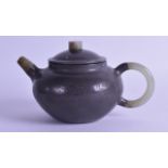 A CHINESE QING DYNASTY PEWTER OVERLAID YIXING POTTERY TEAPOT AND COVER with jade fittings. Signed.