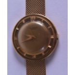 A GOOD 18CT YELLOW GOLD UNIVERSAL WRISTWATCH with gold strap. 55 grams overall. 3.25 cm diameter.