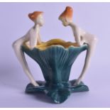 A 1950S NOVELTY TULIP BOWL modelled with two nude nymphs overlooking the rim. 15 cm wide.