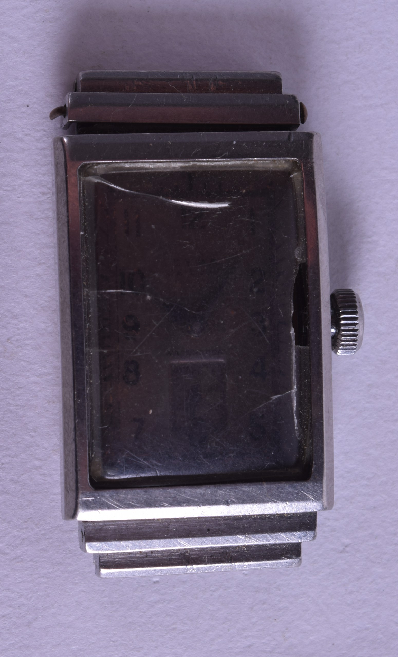 A 1930S CYMA DELUXE RECTANGULAR WRISTWATCH with black numerals. 2 cm x 3.5 cm.