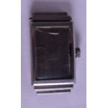 A 1930S CYMA DELUXE RECTANGULAR WRISTWATCH with black numerals. 2 cm x 3.5 cm.