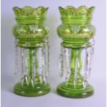 A PAIR OF ANTIQUE BOHEMIAN GLASS TABLE LUSTRES with enamelled floral decoration. 38 cm high.