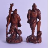 A PAIR OF EARLY 20TH CENTURY CHINESE CARVED HARDWOOD FIGURES modelled upon naturalistic bases. 15 cm