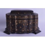 A VICTORIAN PAPIER MACHE SEA WEED LACQUERED TEA CADDY AND COVER decorated with scrolling vines and