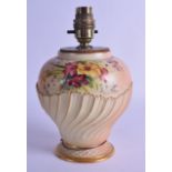 A ROYAL WORCESTER BLUSH IVORY PORCELAIN VASE with lamp fittings, painted with floral sprays upon a