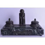 A 19TH CENTURY FRENCH BRONZE EGYPTIAN REVIVAL BRONZE INKWELL upon a veined marble base. 32 cm wide.