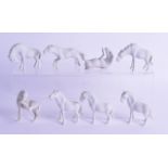 A SET OF EIGHT 19TH CENTURY CHINESE BLANC DE CHINE PORCELAIN HORSES each modelled in a different