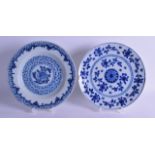 TWO 18TH CENTURY DELFT BLUE AND WHITE PLATES painted with flowers. 23 cm diameter. (2)