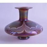 A STYLISH EUROPEAN IRIDESCENT BULBOUS GLASS VASE decorated with swirling motifs. Signed. 14.5 cm