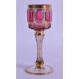 A LATE 19TH CENTURY BOHEMIAN RUBY AND SEAWEED GILT CUP decorated with extensive foliage. 14.25 cm