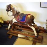 AN ANTIQUE ROCKING HORSE formed from pony hair.