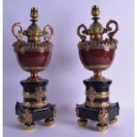 A GOOD PAIR OF 19TH CENTURY TWIN HANDLED HARDSTONE BRONZE AND COPPER VASES converted to lamps,