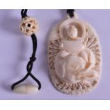 AN EARLY 20TH CENTURY INDIAN CARVED IVORY PENDANT C1910 depicting a Buddhist figure upon an