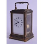 A 19TH CENTURY FRENCH BRASS REPEATING CARRIAGE CLOCK with white enamel dial and black numerals. 18.5