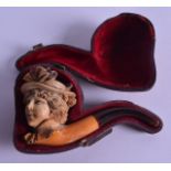 AN ANTIQUE CASED MEERSCHAUM SMOKING PIPE with amber fittings. 12 cm x 7 cm.