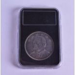 A CHINESE SILVER ONE DOLLAR COIN. 26.7 grams.