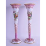 A LARGE PAIR OF ANTIQUE PAINTED OPALINE GLASS FLUTED VASES painted with floral sprays upon a white