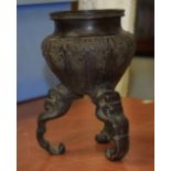 AN ISLAMIC STYLE BRONZE CENSER decorated with extensive foliage. 18 cm high.